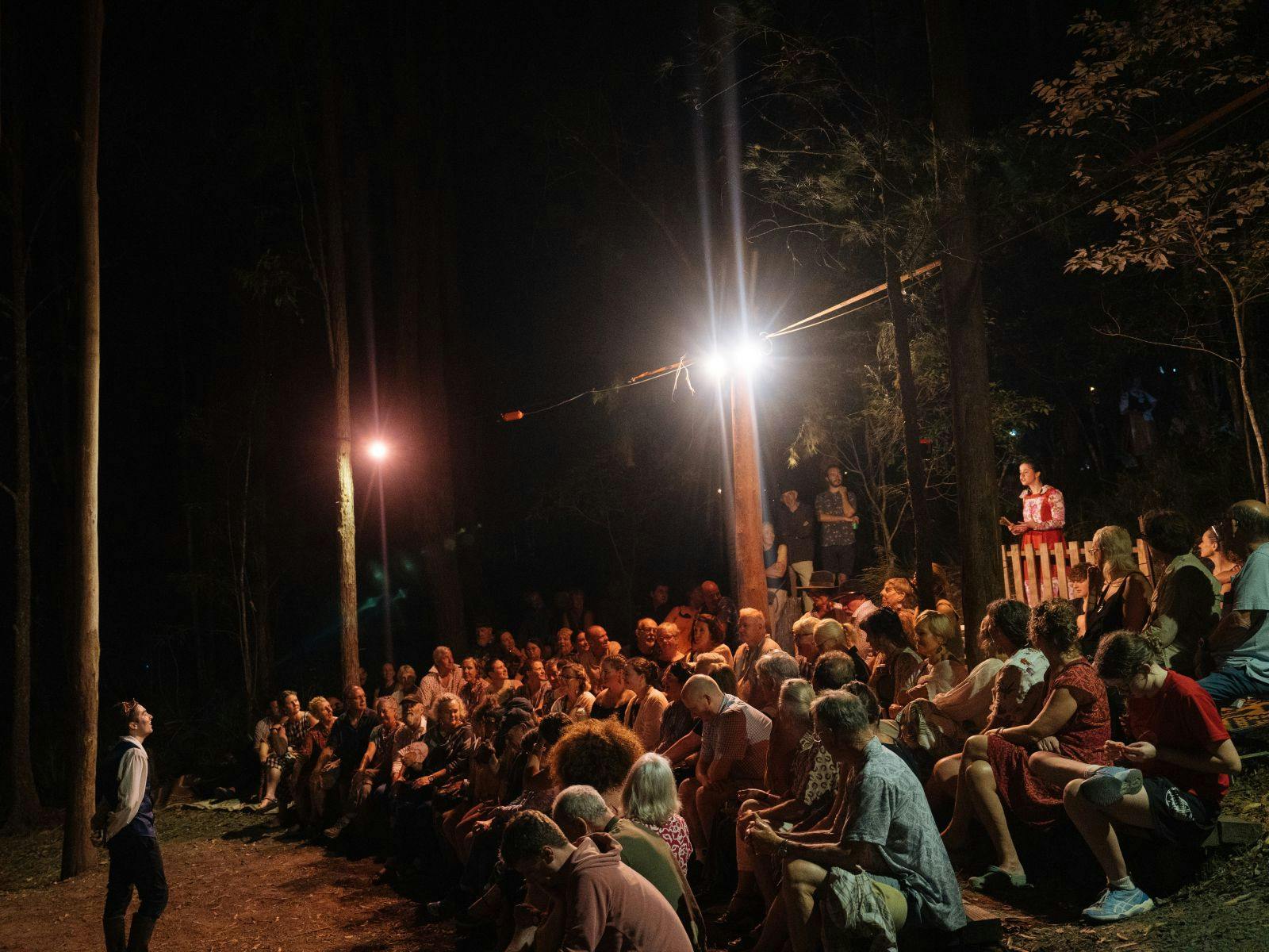 Audience surrounded by actors performing Shakespeare in outdoor theater at Dungog Shakespearience