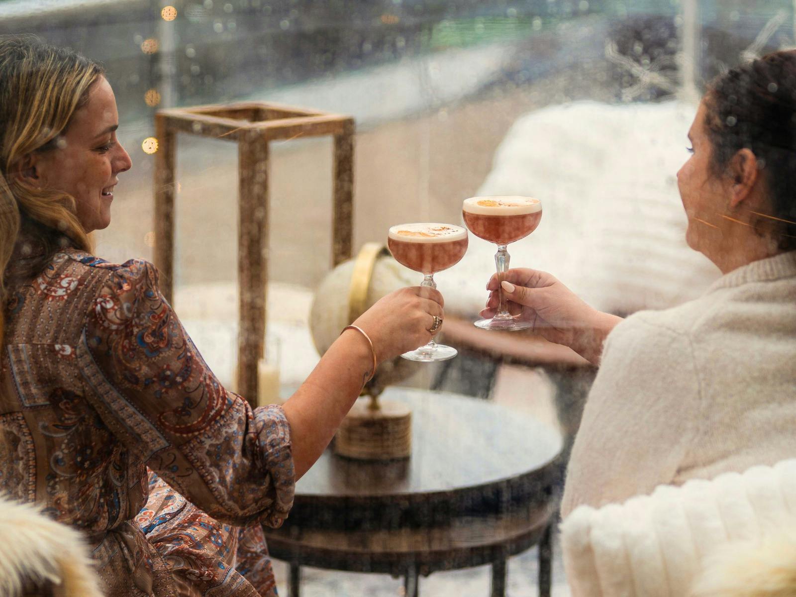 Guests in the Winter Domes with cocktails