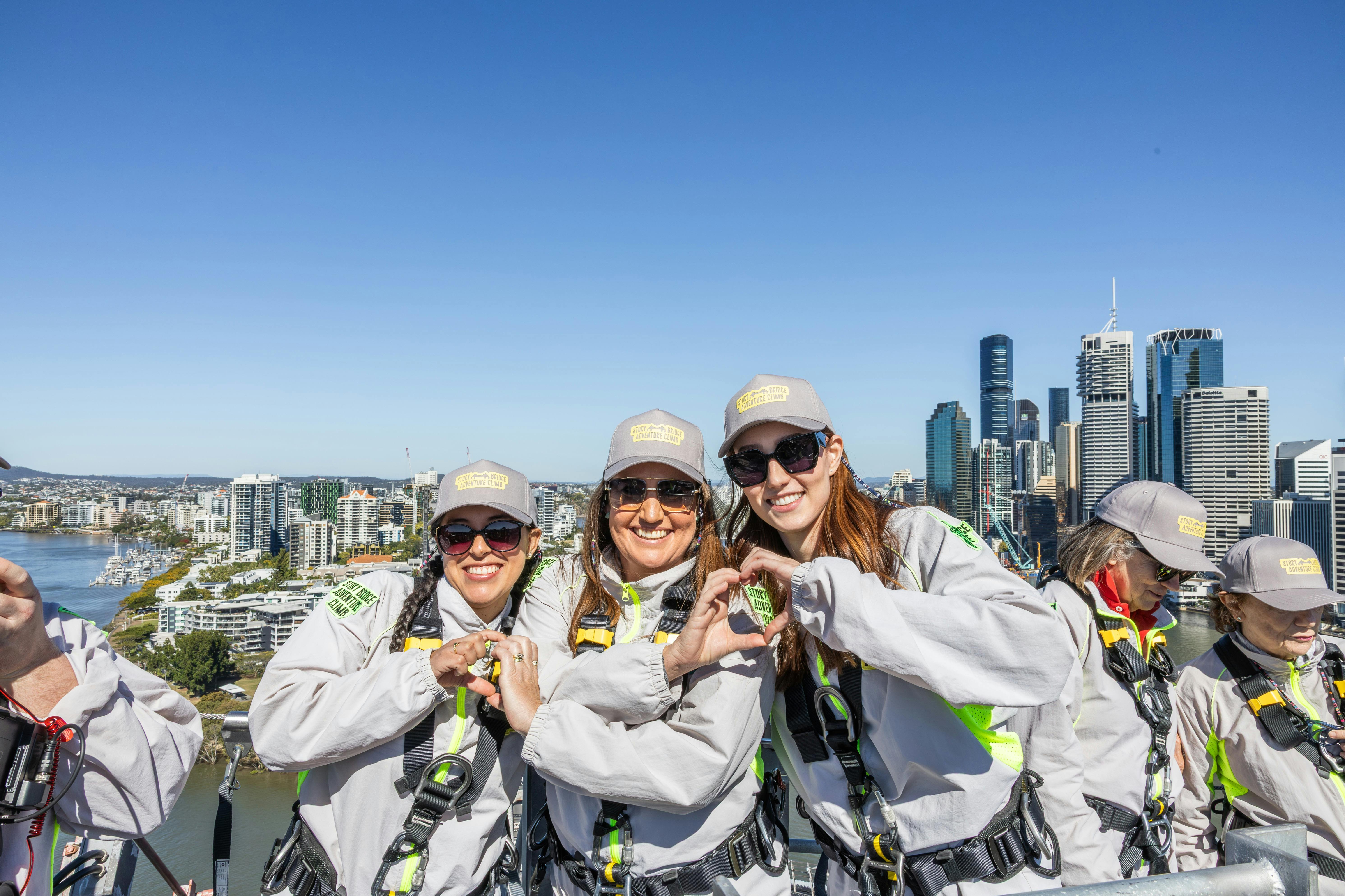 Climbers on the Brisbane Story Bridge Adventure Climb with city skyline views