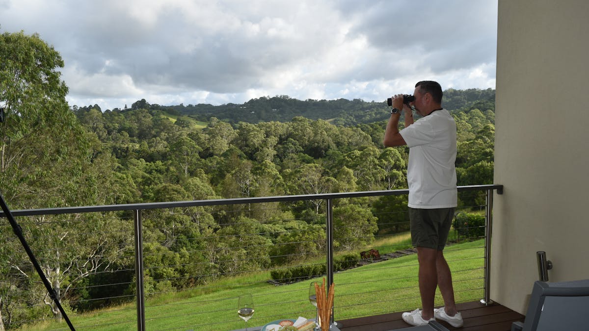 A guest enjoying birdwatching from guest accommodation