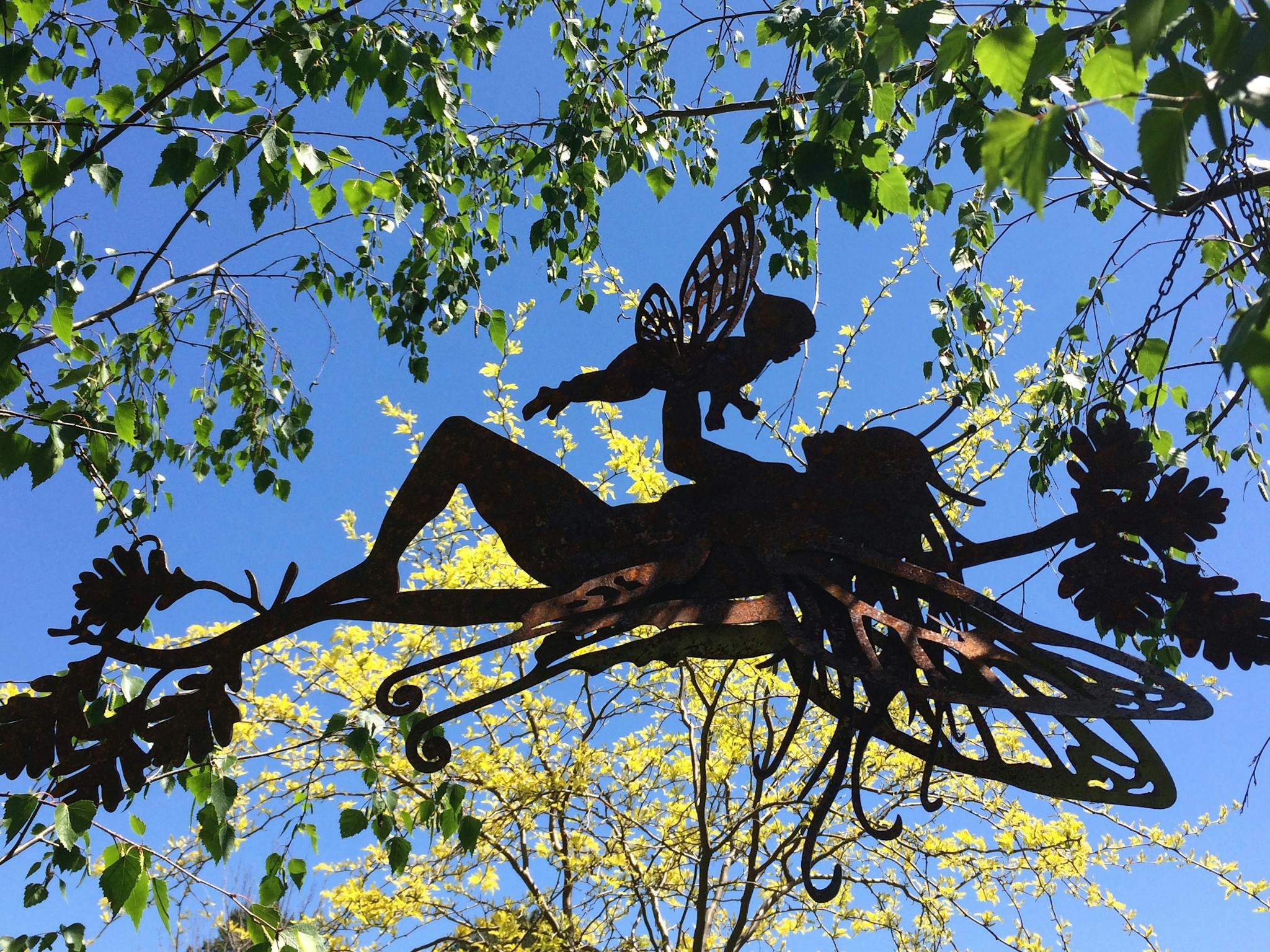 Fairies in the Garden. Plasma cut steel sculpture by Jacky Ragg.
