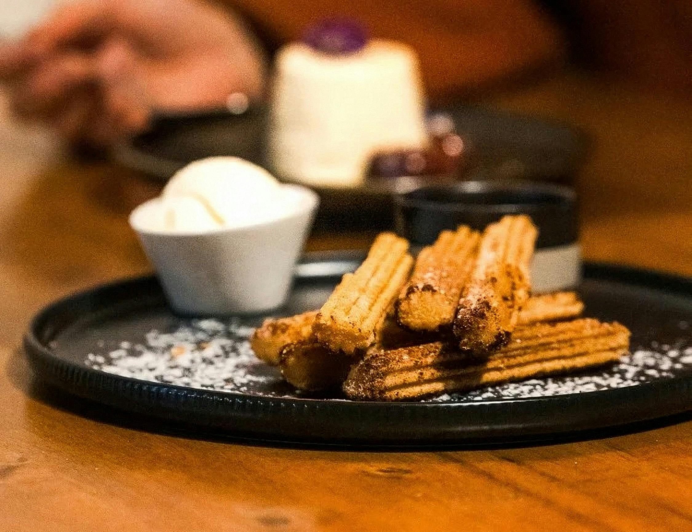 Churos sticks with a bowl of icecream