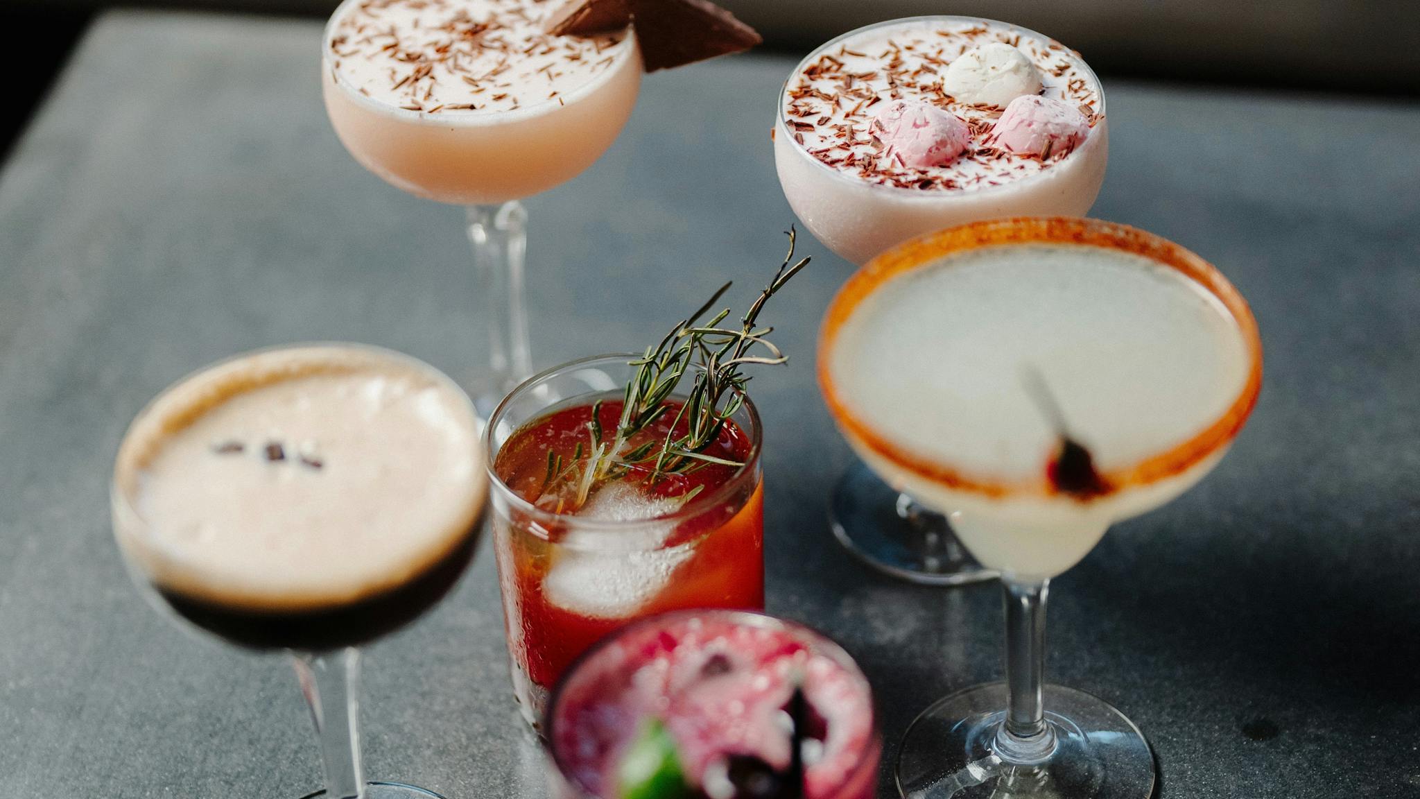 an assortment of six different cocktails