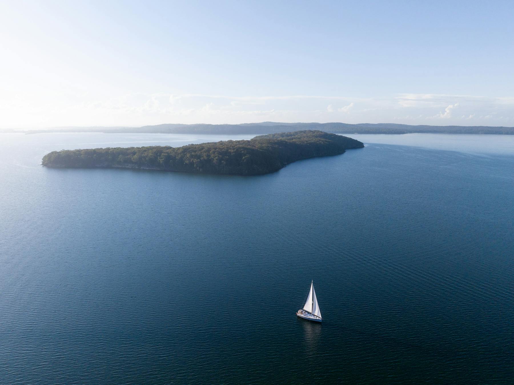 Aerial footage of Sail Lake Macquarie sailing past Pulbah Island