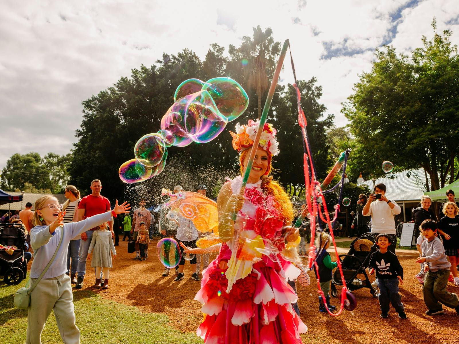 A fairy character creating large soap bubbles