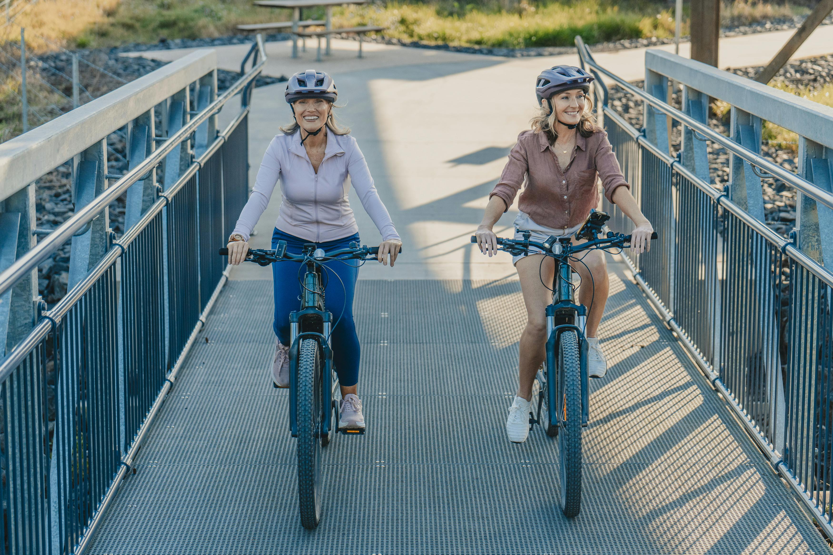two ladies to ebikes