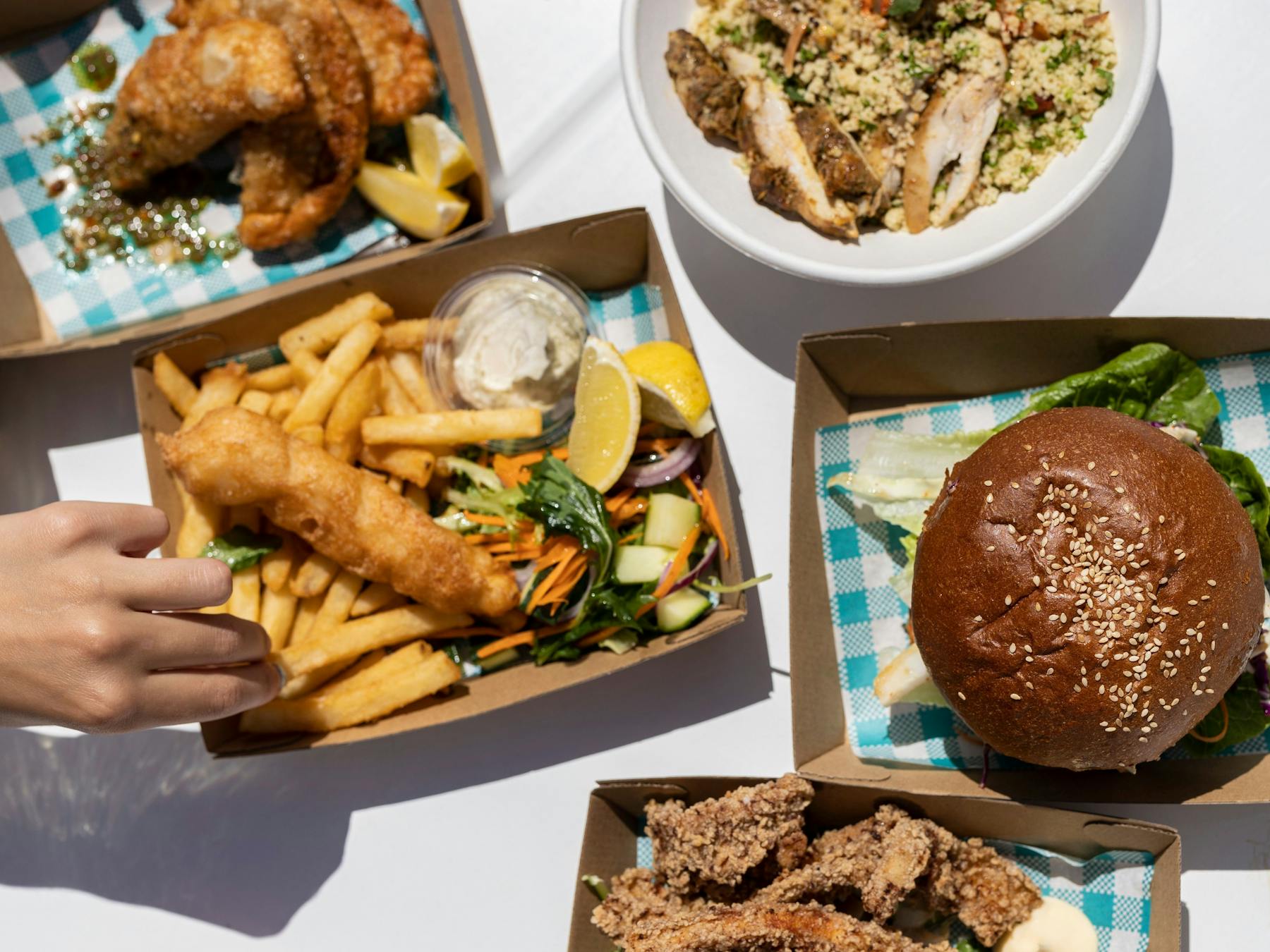Fish and chips and burgers in a picnic setting