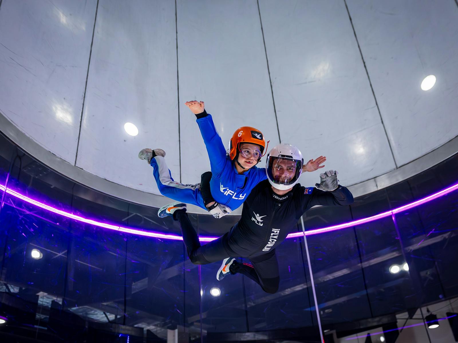 Instructor takes small kid for a high fly!