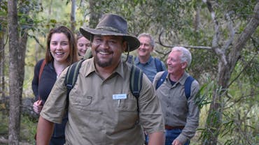 The host of Yarriba Dreaming shares his cultural knowledge with small walking groups. The host of Yarriba Dreaming shares his cultural knowledge with small walking groups.