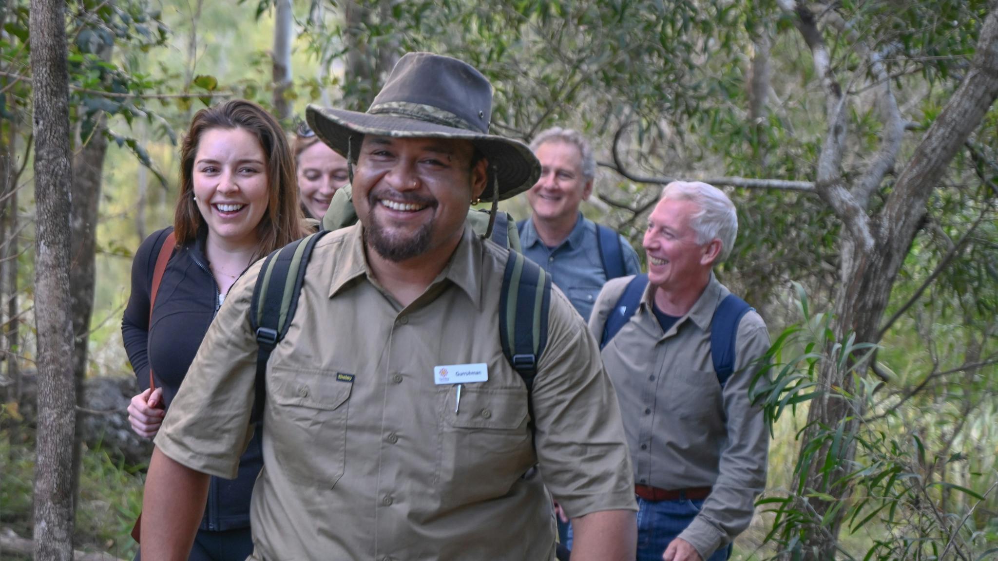 The host of Yarriba Dreaming shares his cultural knowledge with small walking groups. The host of Yarriba Dreaming shares his cultural knowledge with small walking groups.