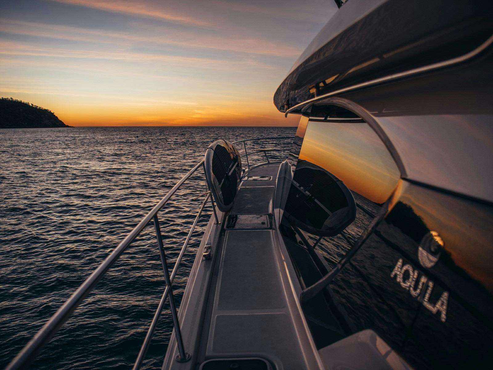 Aquila 44 - side of vessel at sunset