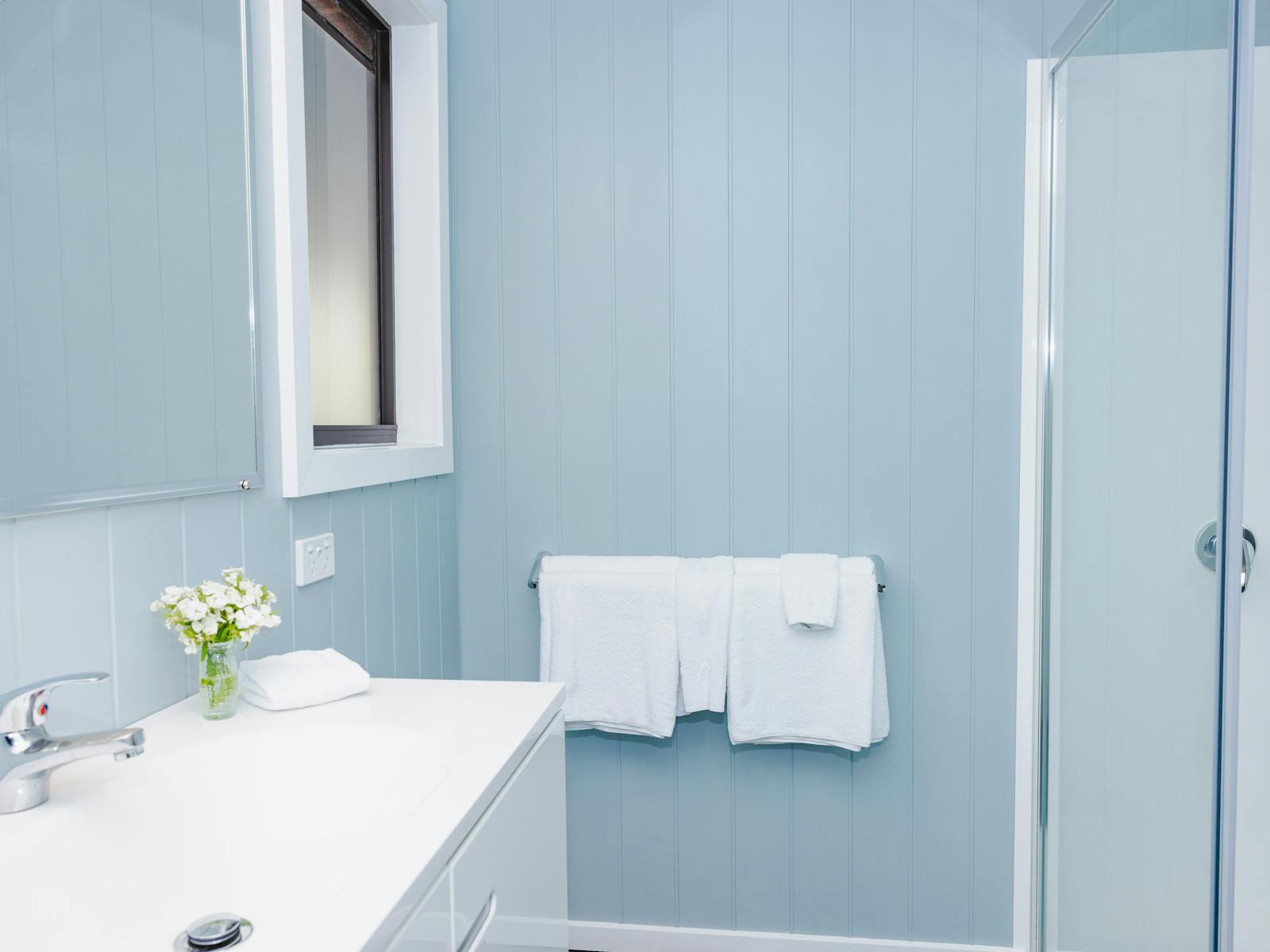 Modern bathroom, hair dryer, towels
