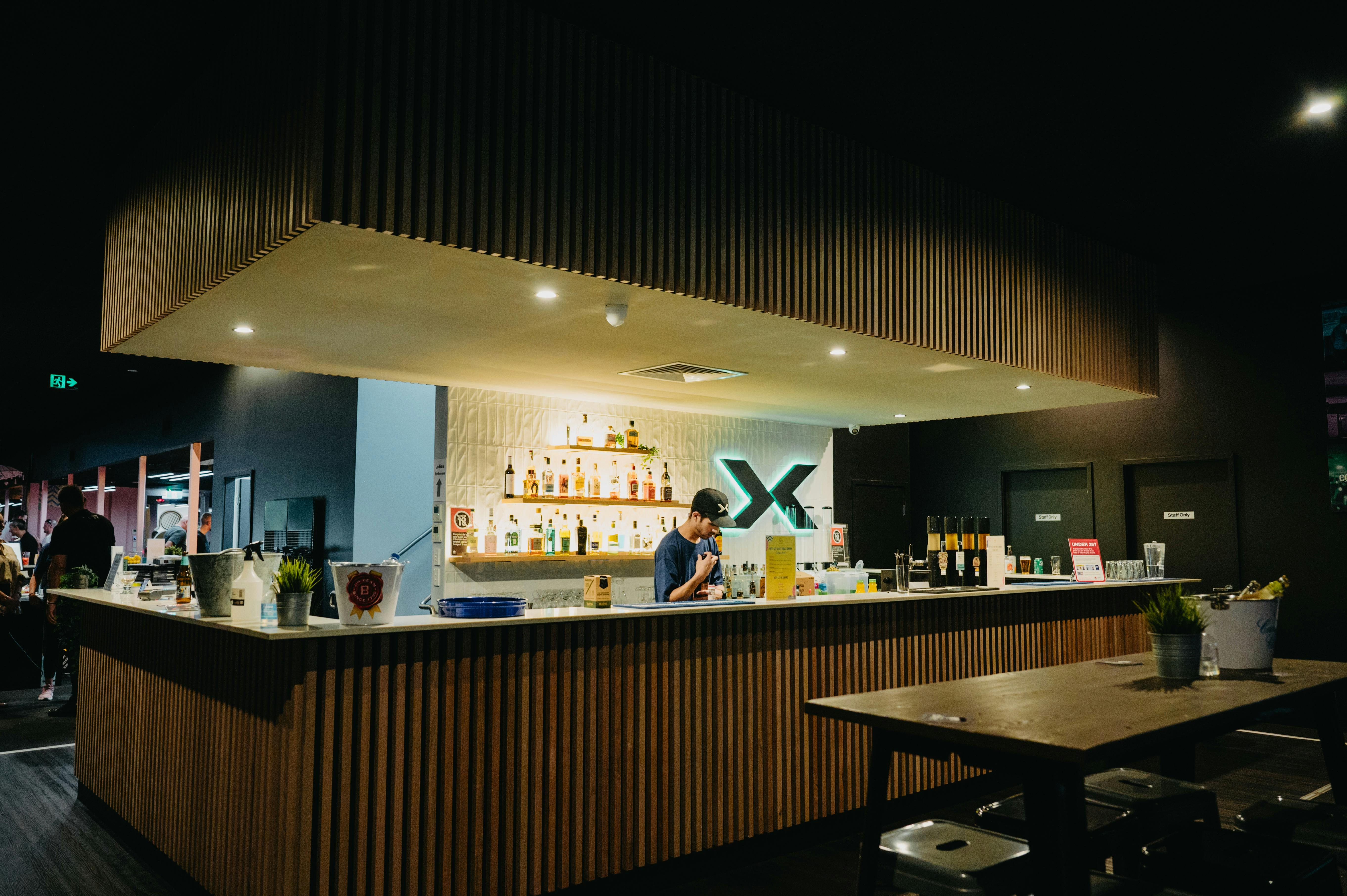 Man Making Cocktail on the X-Golf Sports Bar