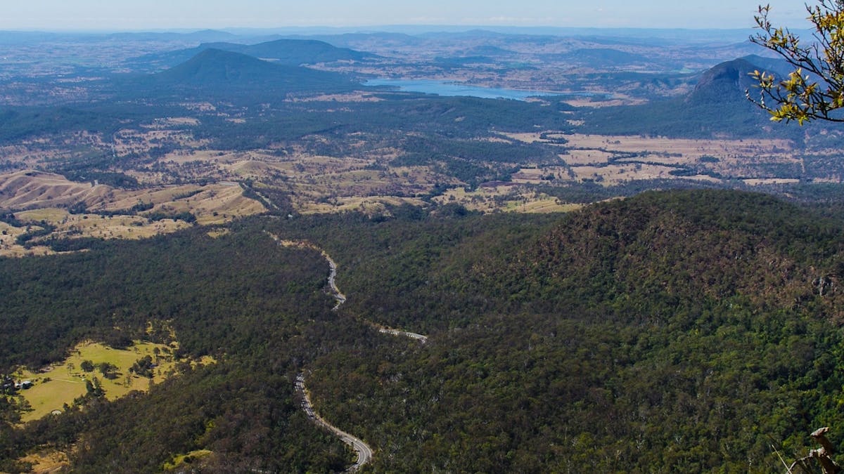 View of mountains, road, lake, farmland and forest. View of mountains, road, lake, farmland and forest.