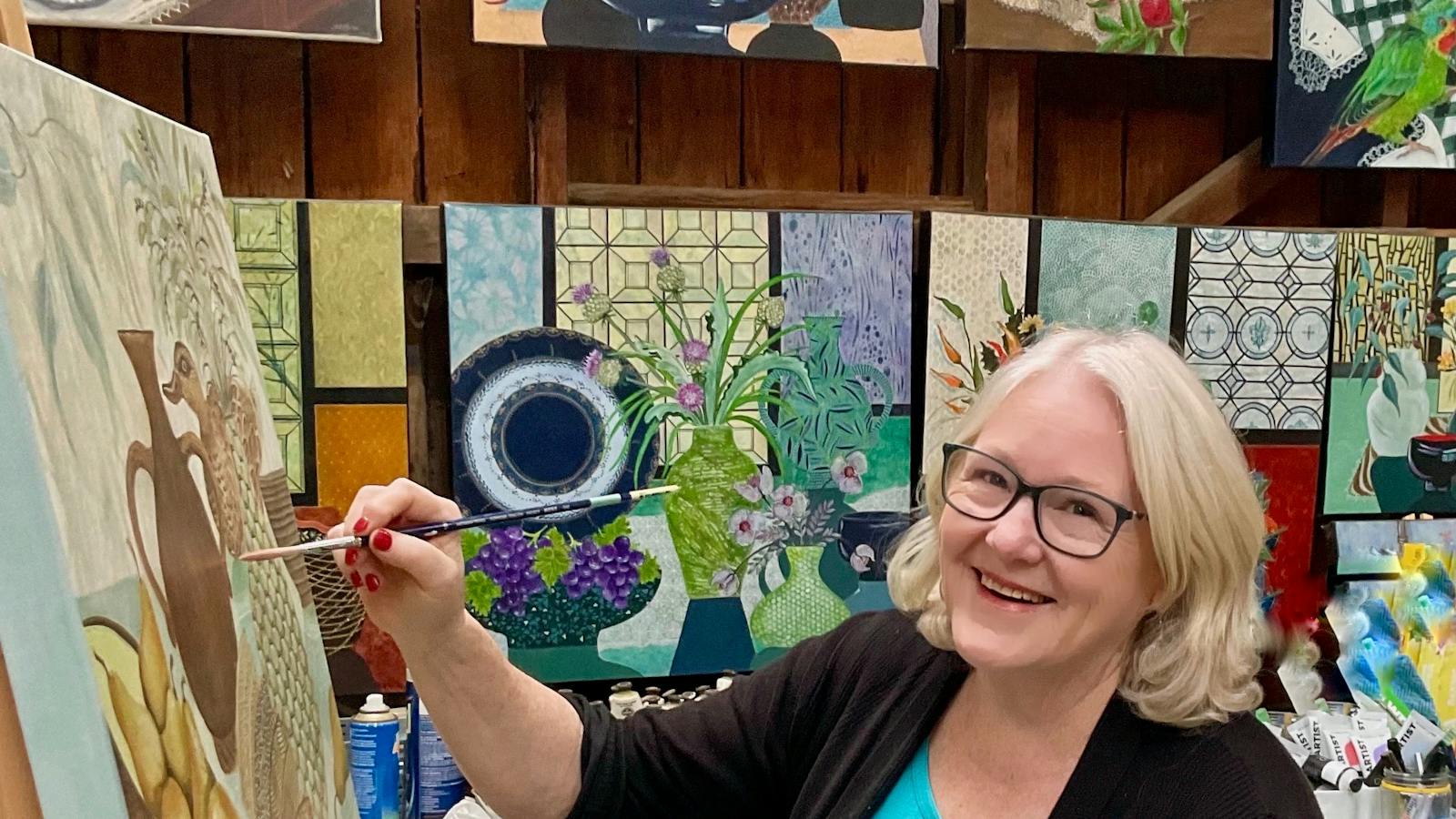 Heather Crisp artist painting in her studio