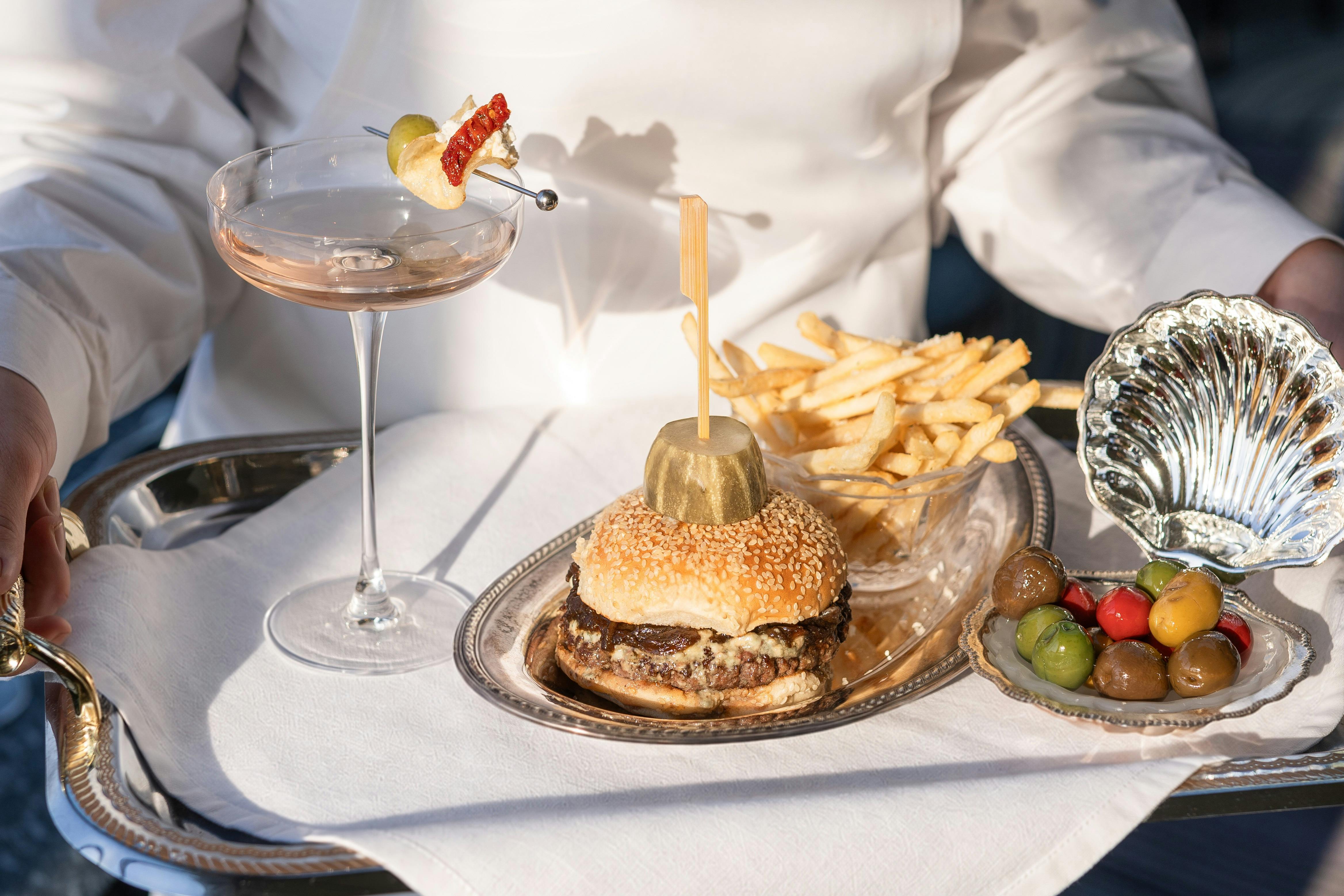 A selection of the salty bar snacks with a Martini to accompany it