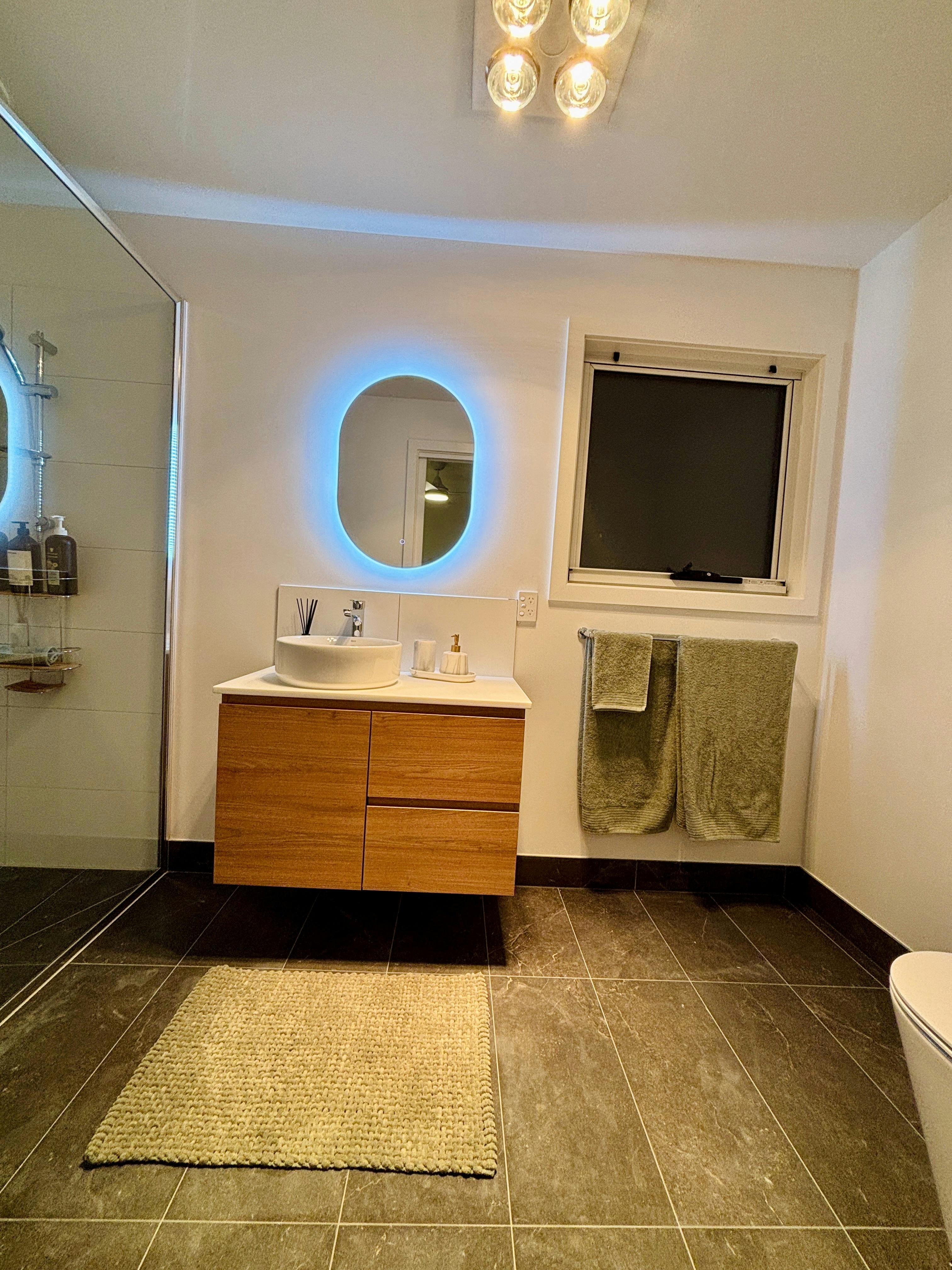 Full bathroom with large shower, storage and toiletries supplied.