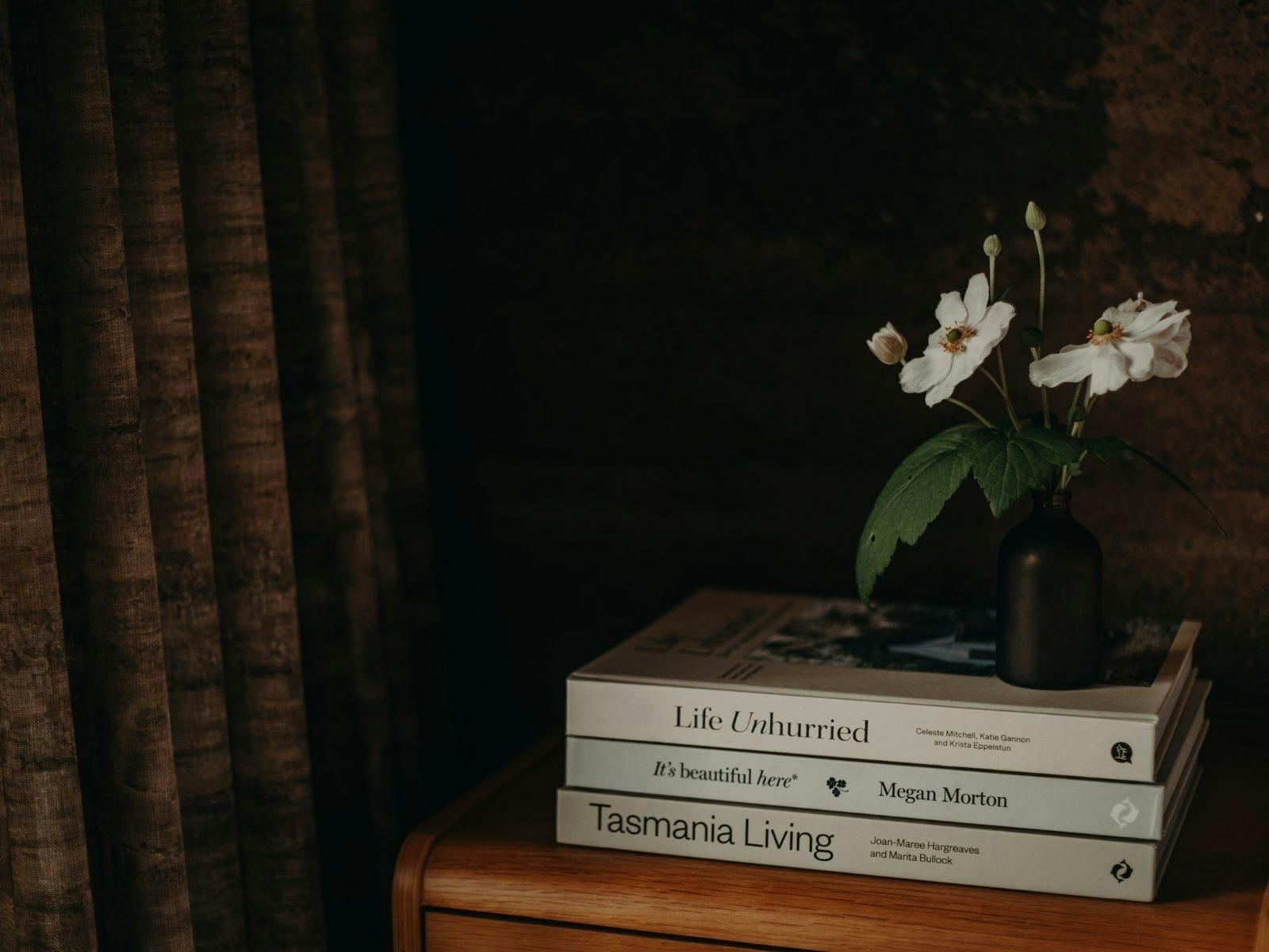 books on a bedside table