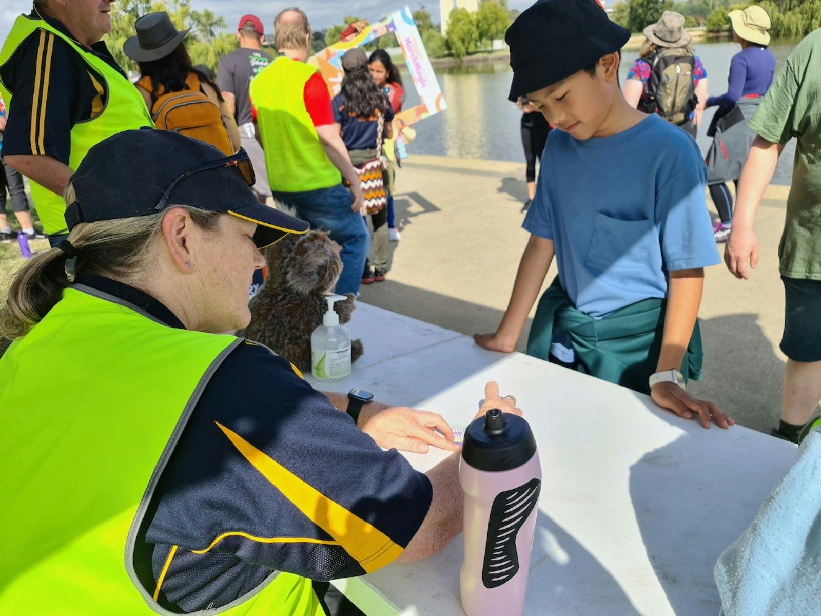 a young boy getting his card stamped
