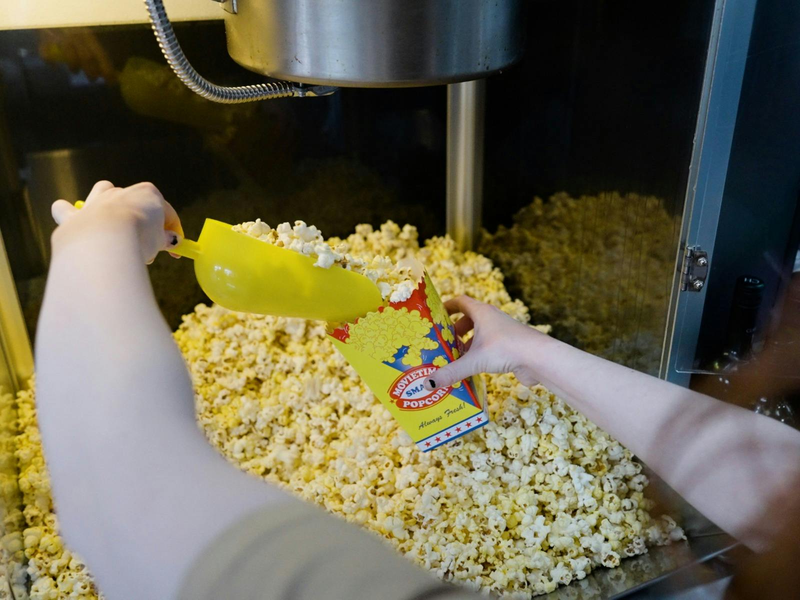 Easy Tiger Cinema in St Helens filling a colourful box with fresh popcorn