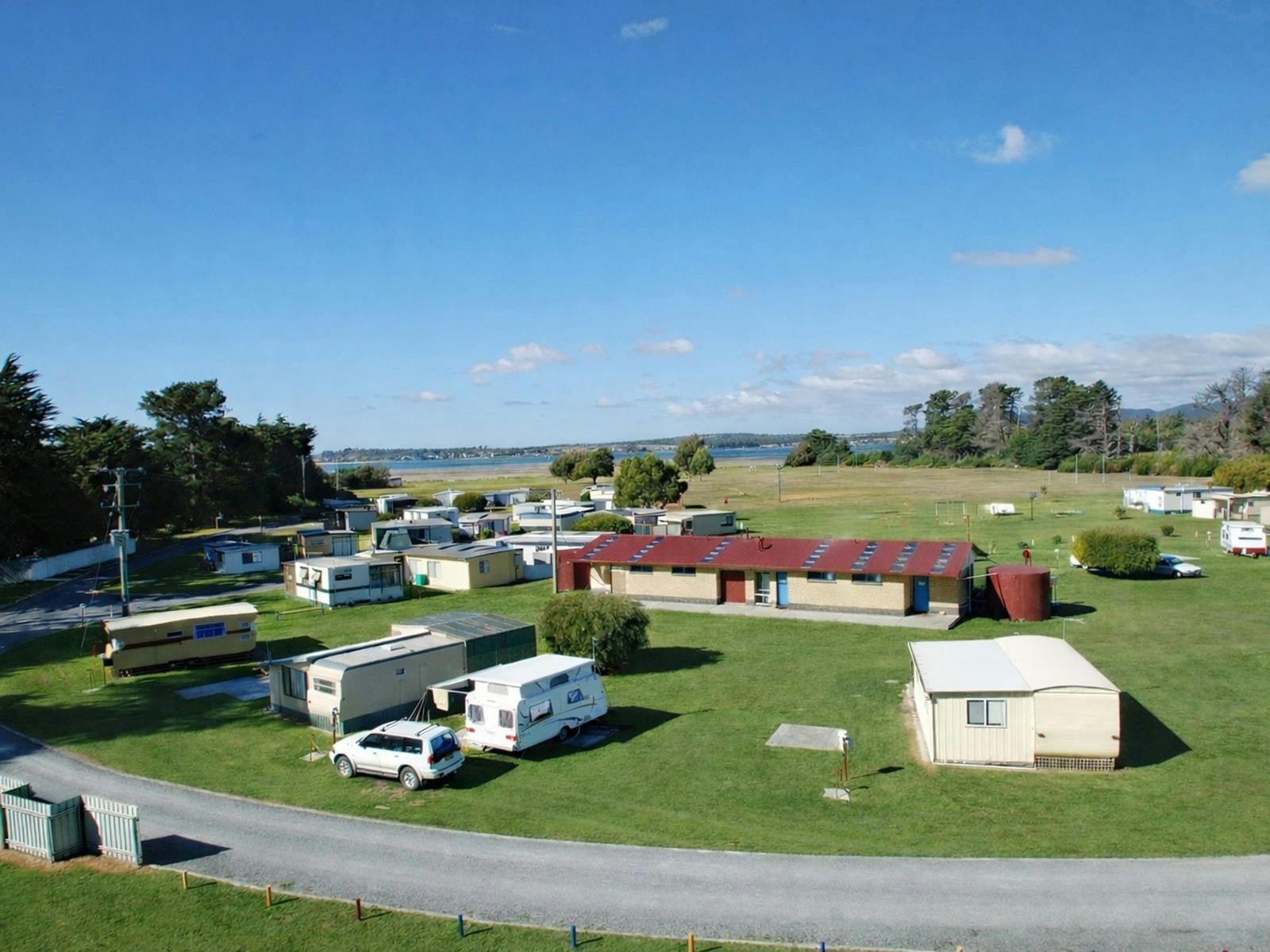 Cosy family cabins and camping by the river image