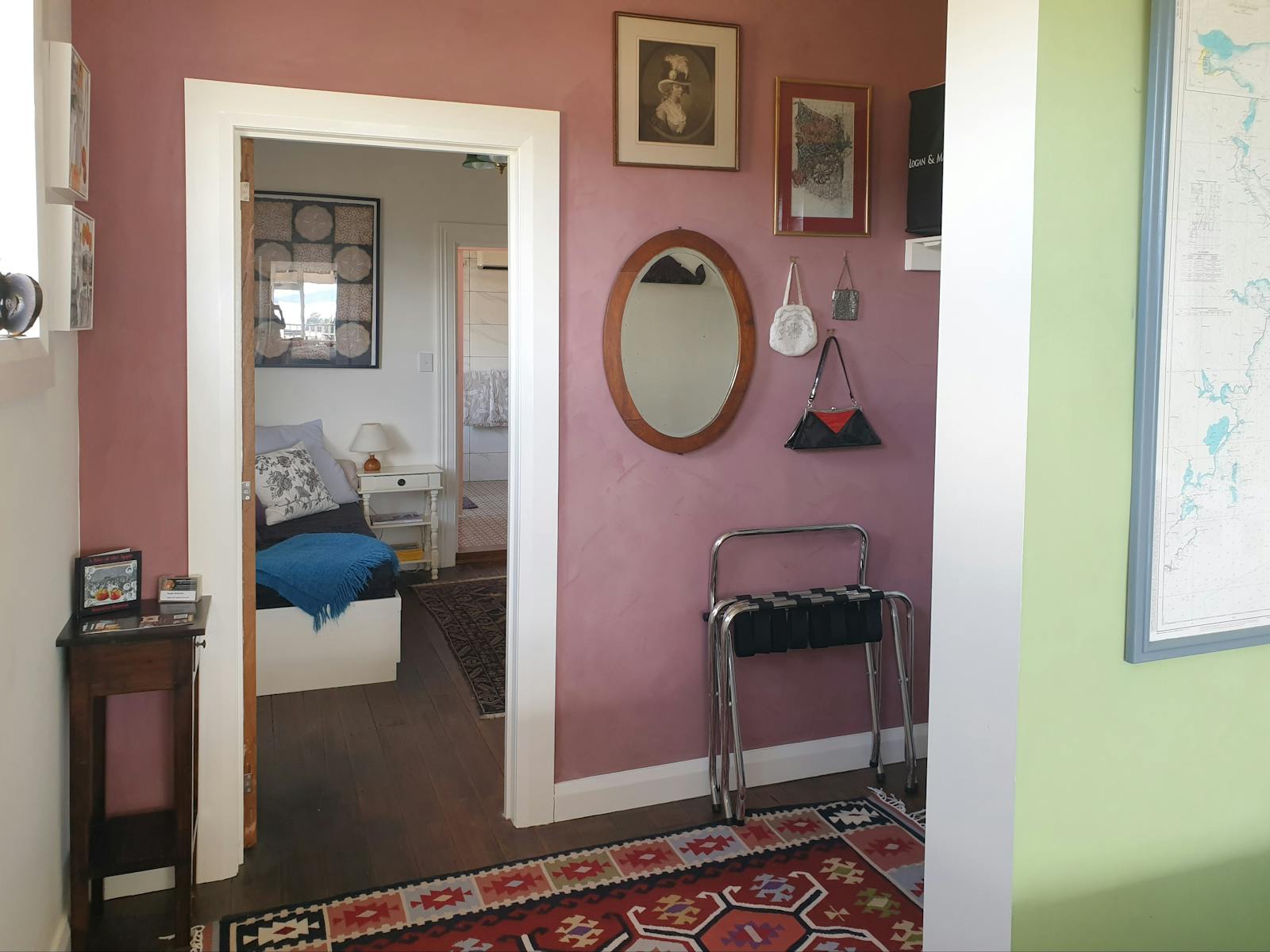 Walk in wardrobe and changing are with view through door to the library