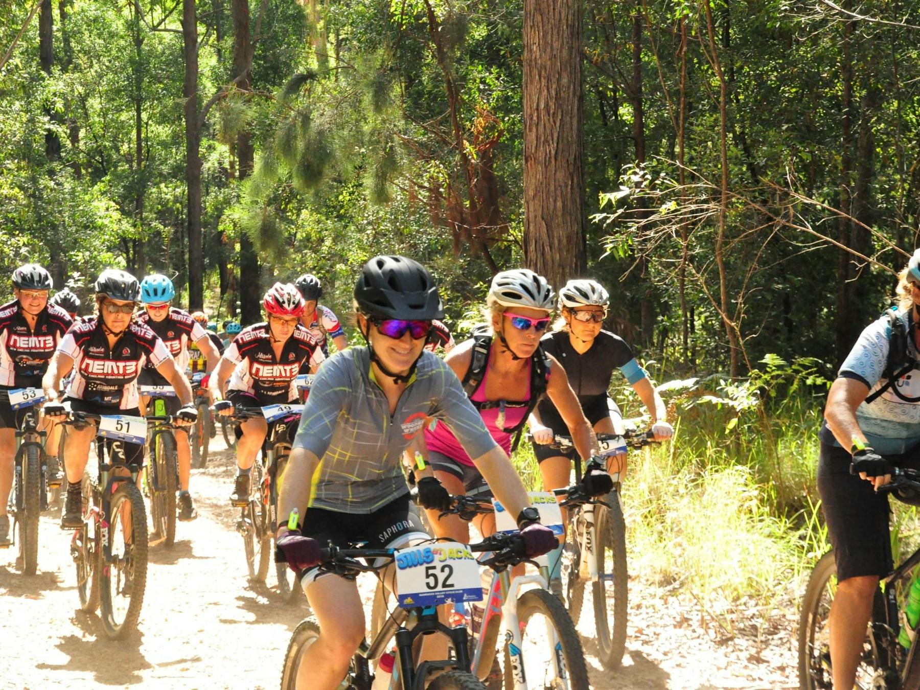 Women having a great time racing the trails at Jacks