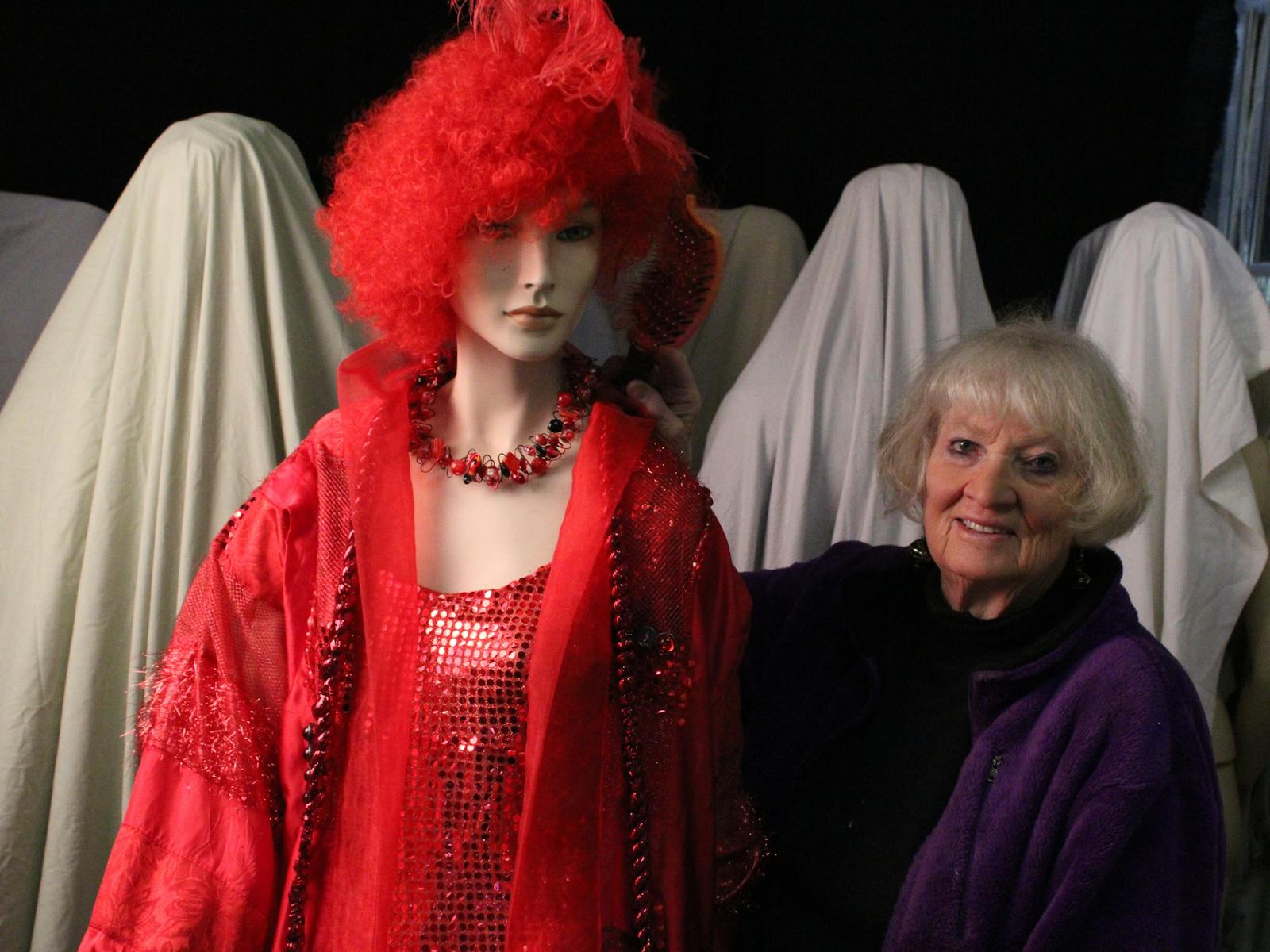 Dressed mannequin and artist/maker at Museum of Wearable Art