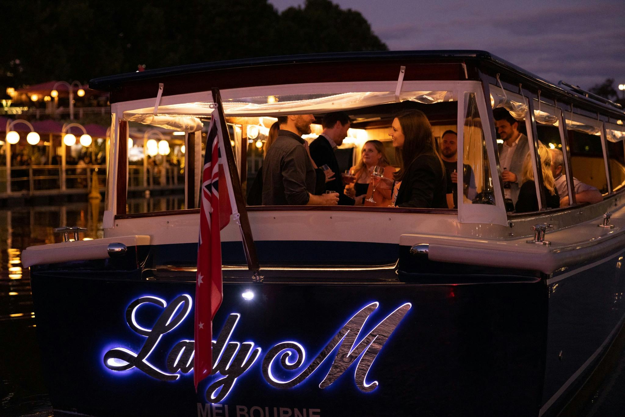 Lady M cruising at night on the Yarra River