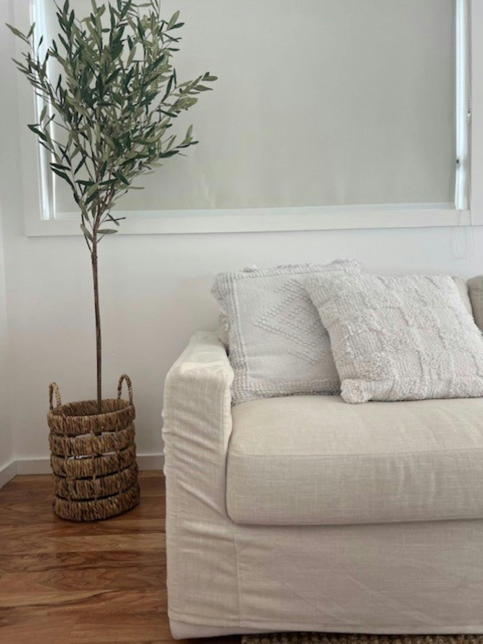 Linen look couch and indoor plant, privacy blind