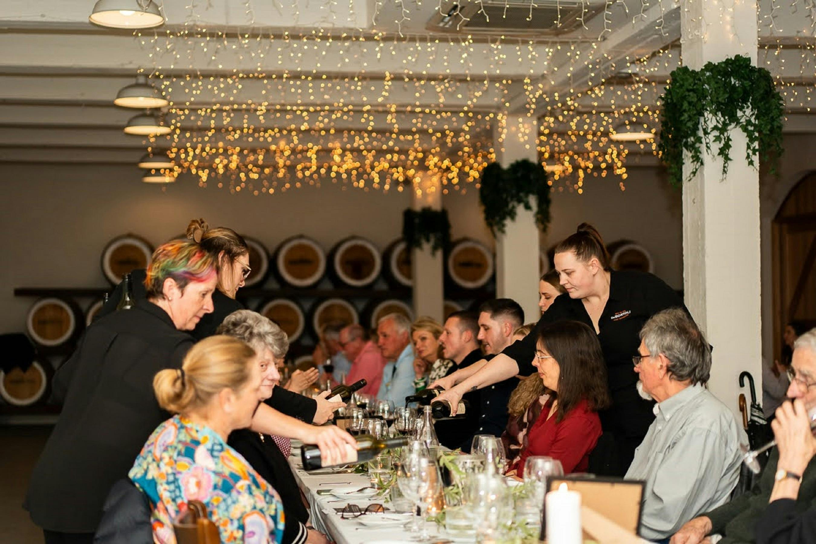 staff serving wine in Muscat Hall at De Bortoli Rutherglen Estate