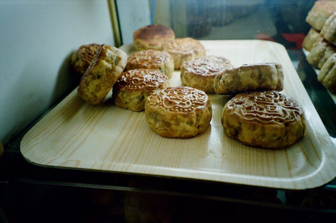 A photograph of mooncakes sitting on a tray