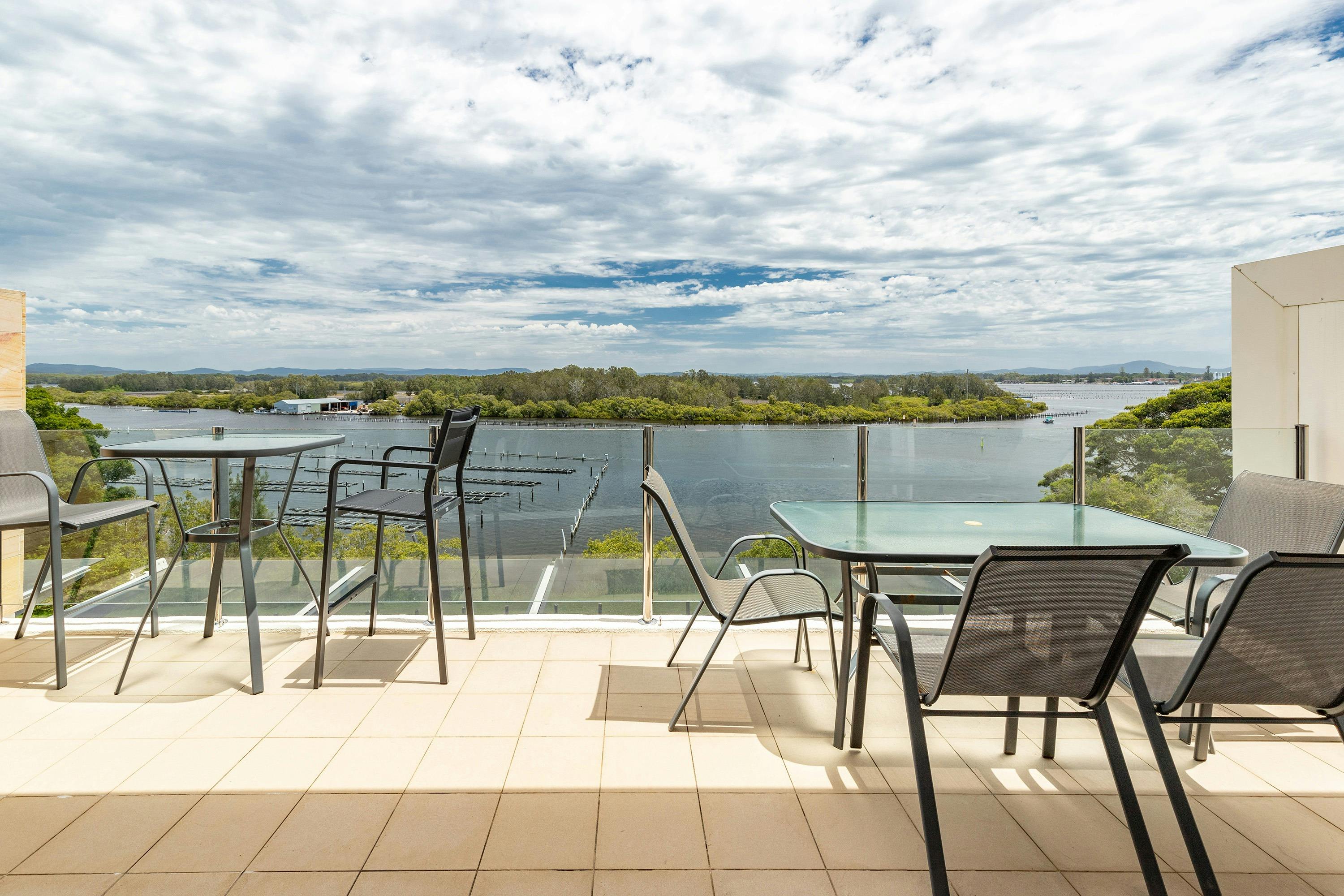 Balcony with lake view, casual and dining settings