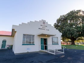 Cream coloured brick building with Millicent RSL Memorial Club written across the front.