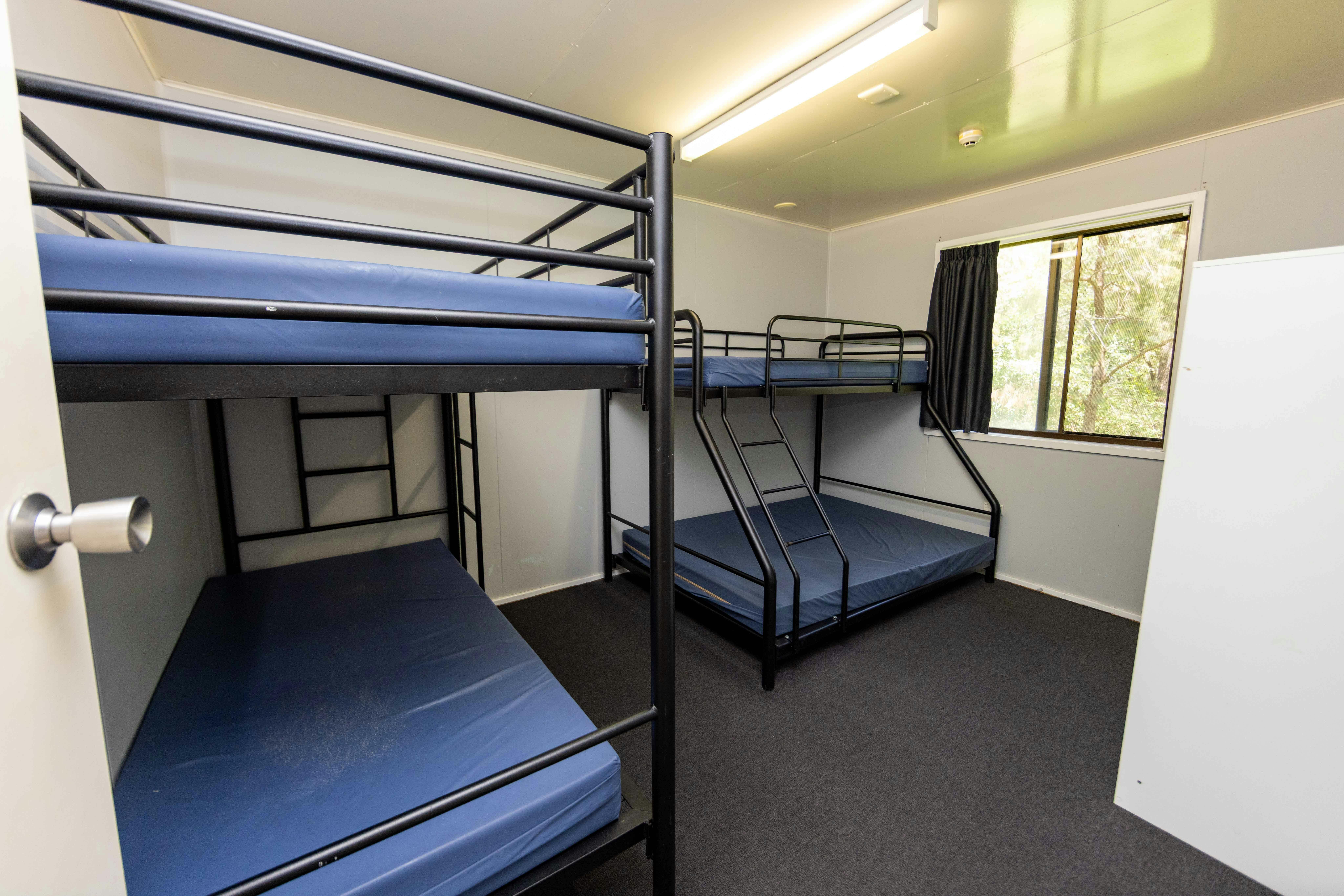 Bedroom with two sets of large bunk-beds