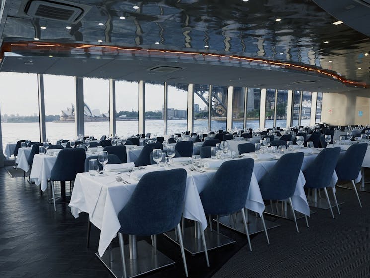 Spacious dining saloon with formal setup on the Clearview lunch cruise.