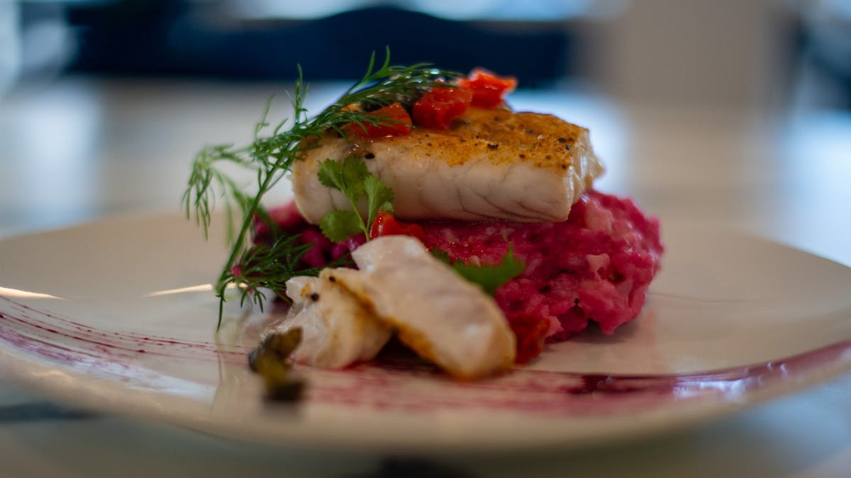 Seared market dish with risotto