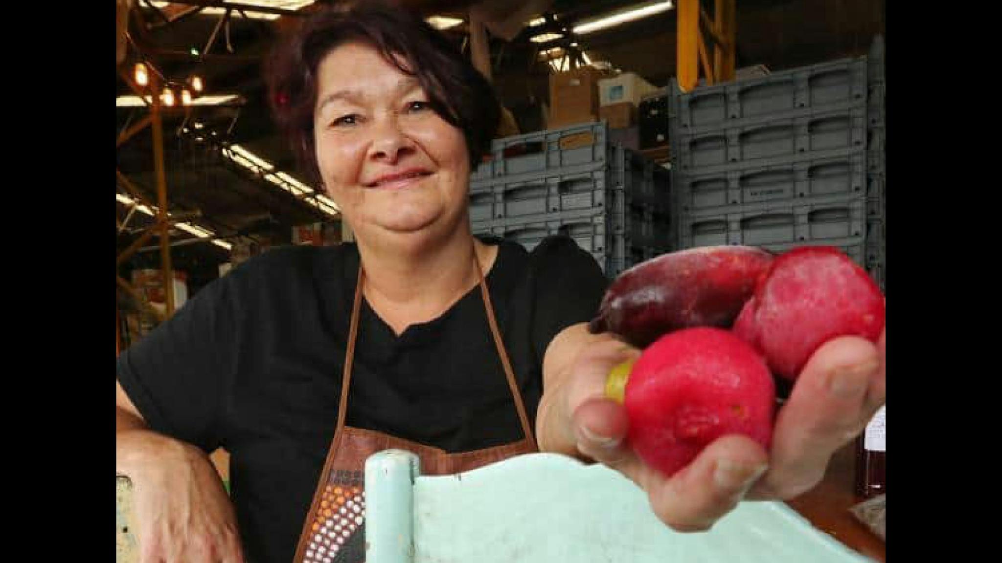 Aunty Dale Chapman holding Davidson Plum and Finger Lime Aunty Dale Chapman holding Davidson Plum and Finger Lime