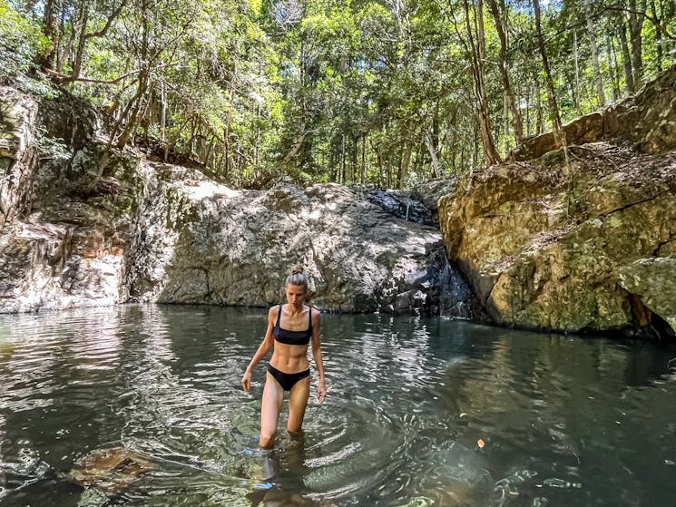 Woman coming out of the pool at Unicorn falls in Mount Jerusalem National Park