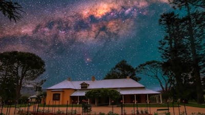 Lanyon Homestead at night with stars visible in the sky above