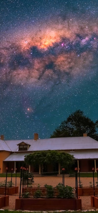 Lanyon Homestead at night with stars visible in the sky above