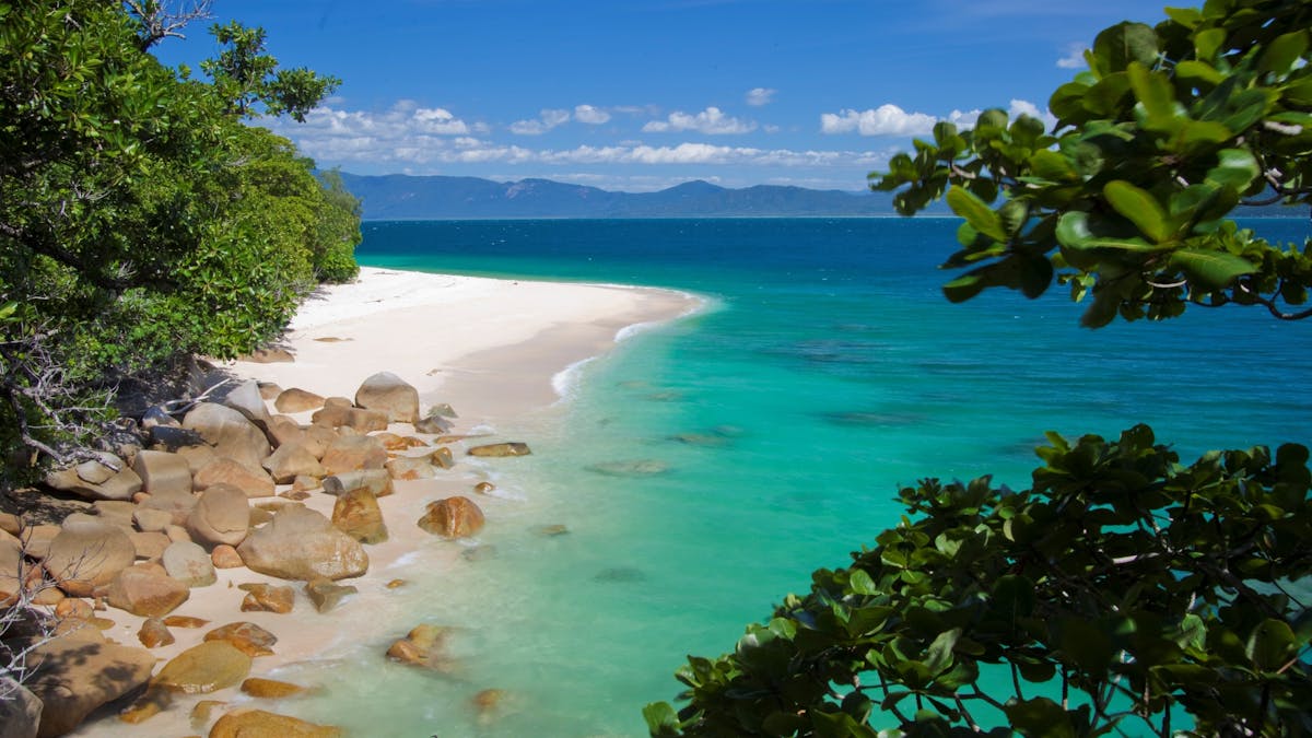 The pristine white sands and turquoise waters of Nudey Beach at Fitzroy Island, Great Barrier Reef
