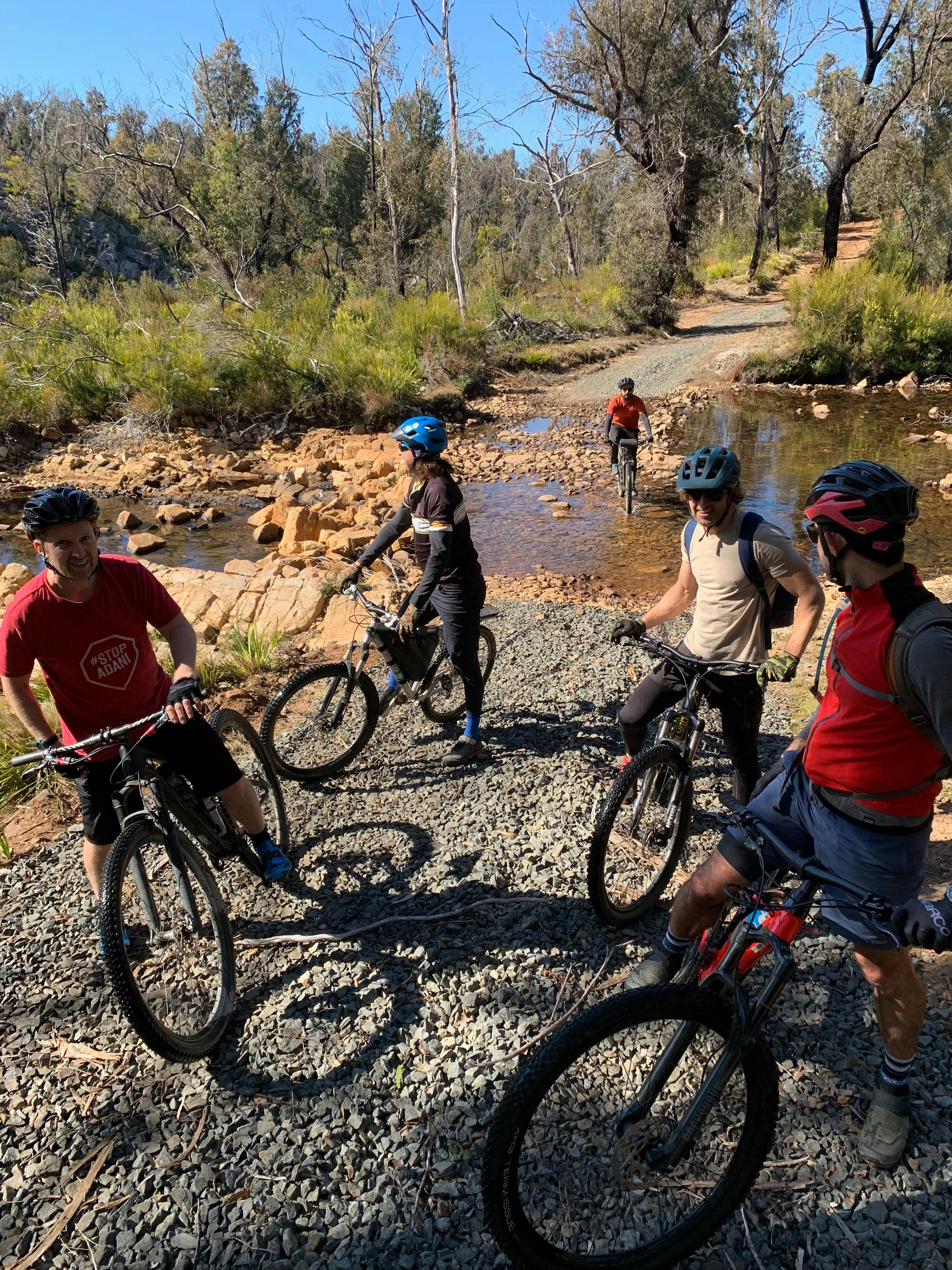 Cyclists next to river