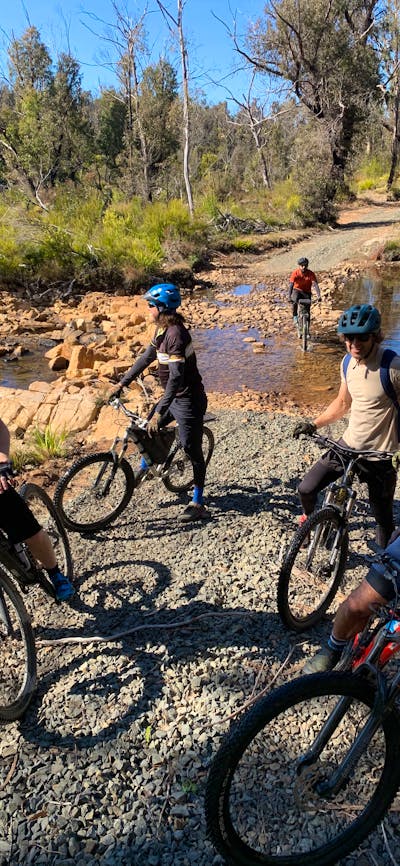 Cyclists next to river