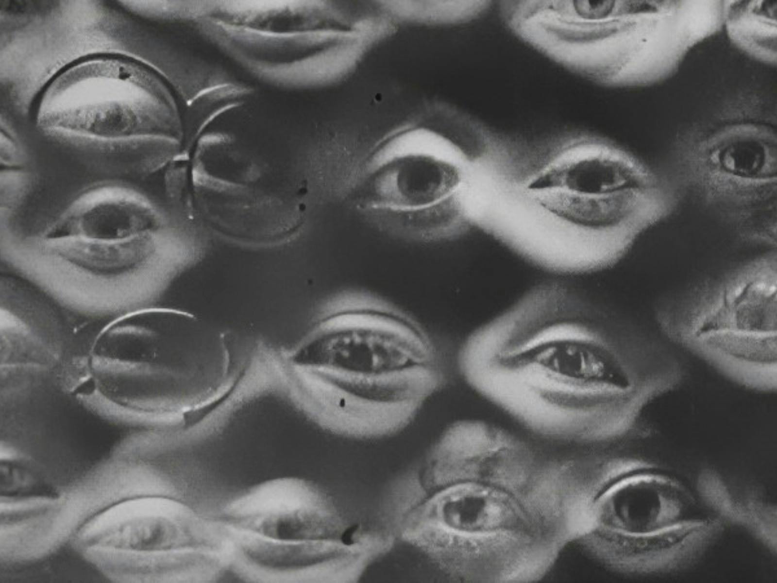Black and white image of many human eyes