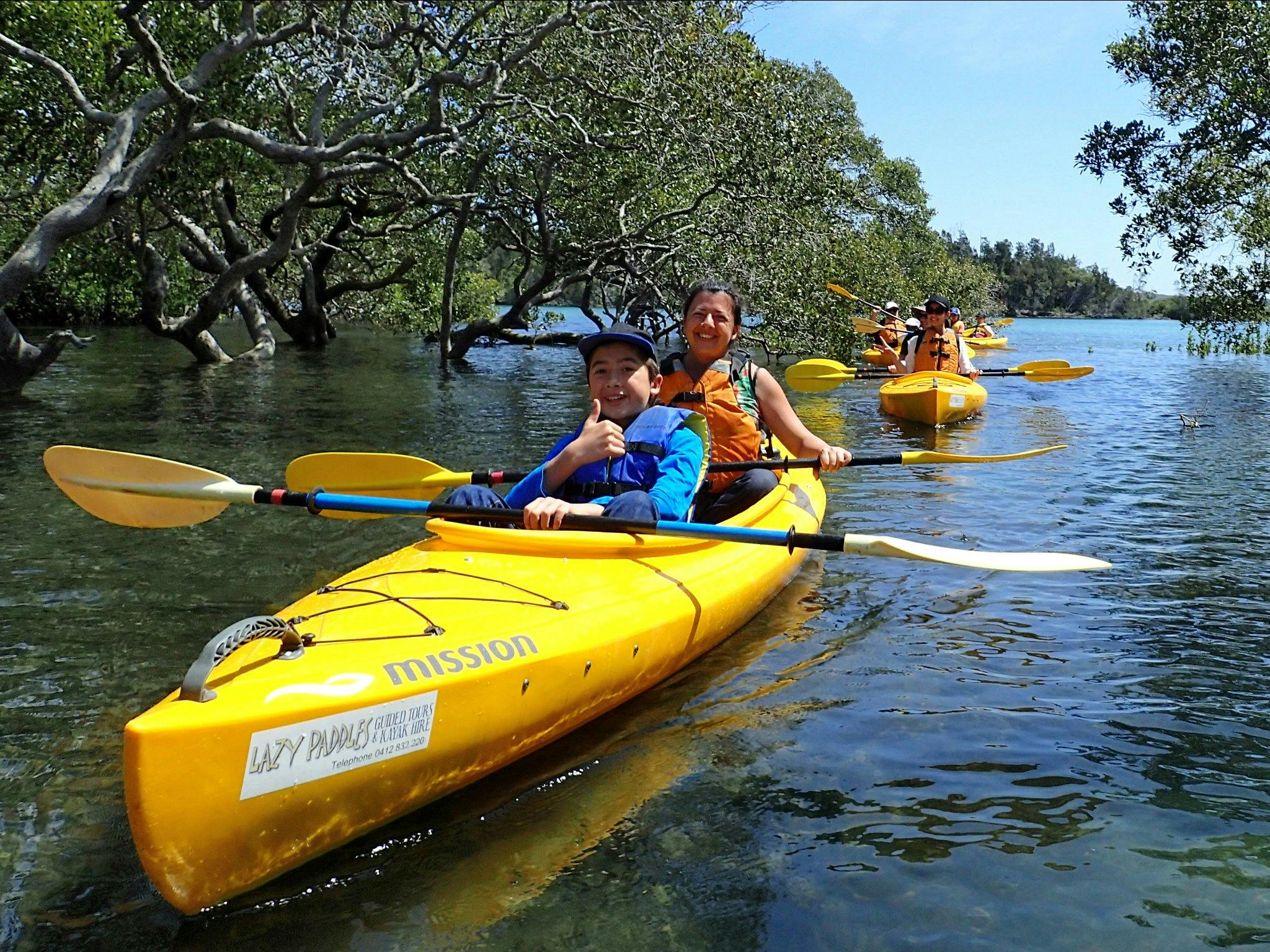 Mother and son enjoying a guided kayak tour