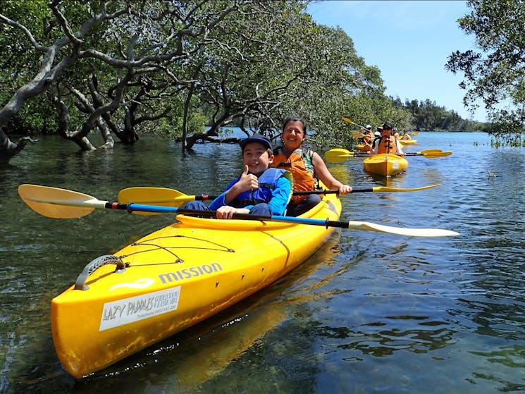 Mother and son enjoying a guided kayak tour