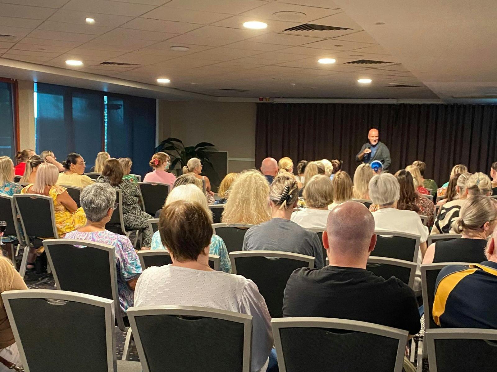 Aussie medium, Simon Hay doing a live mediumship event.
