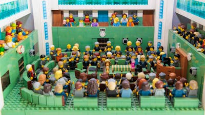 Plastic toys seated in various positions