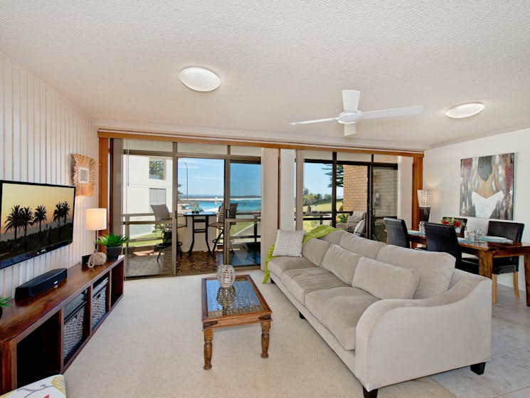 Lounge and dining area with beach views